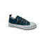 Displayed on a plain white background is the Aman Navy Tooled Sneaker by VERY G, featuring a navy upper with white toe cap, thick white sole, and sparkling rhinestone shoelaces. This Western-inspired sneaker is adorned with subtle tooled floral detailing for added charm.