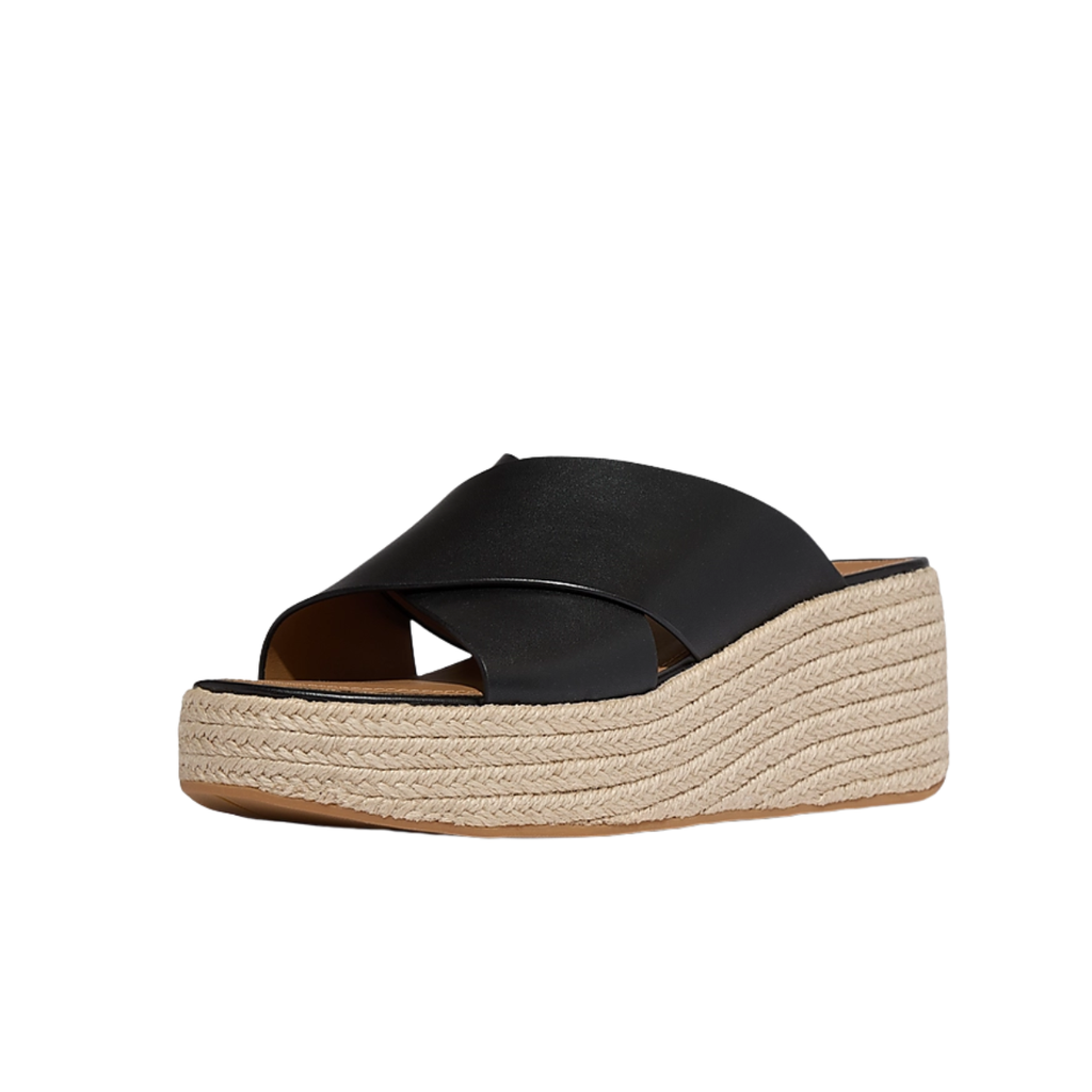 Platforms Espadrille Leather Wedge Cross Slides by FITFLOP USA LLC feature crisscross leather straps, a woven espadrille-style platform sole, and arch support. Shown from a front side angle on a white background.