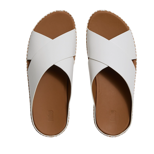 The fit flop Lulu Lux Graphic Weave Leather Cross Cross Slides feature white wide crisscross leather straps and brown footbeds, shown from above for a stylish summer look.