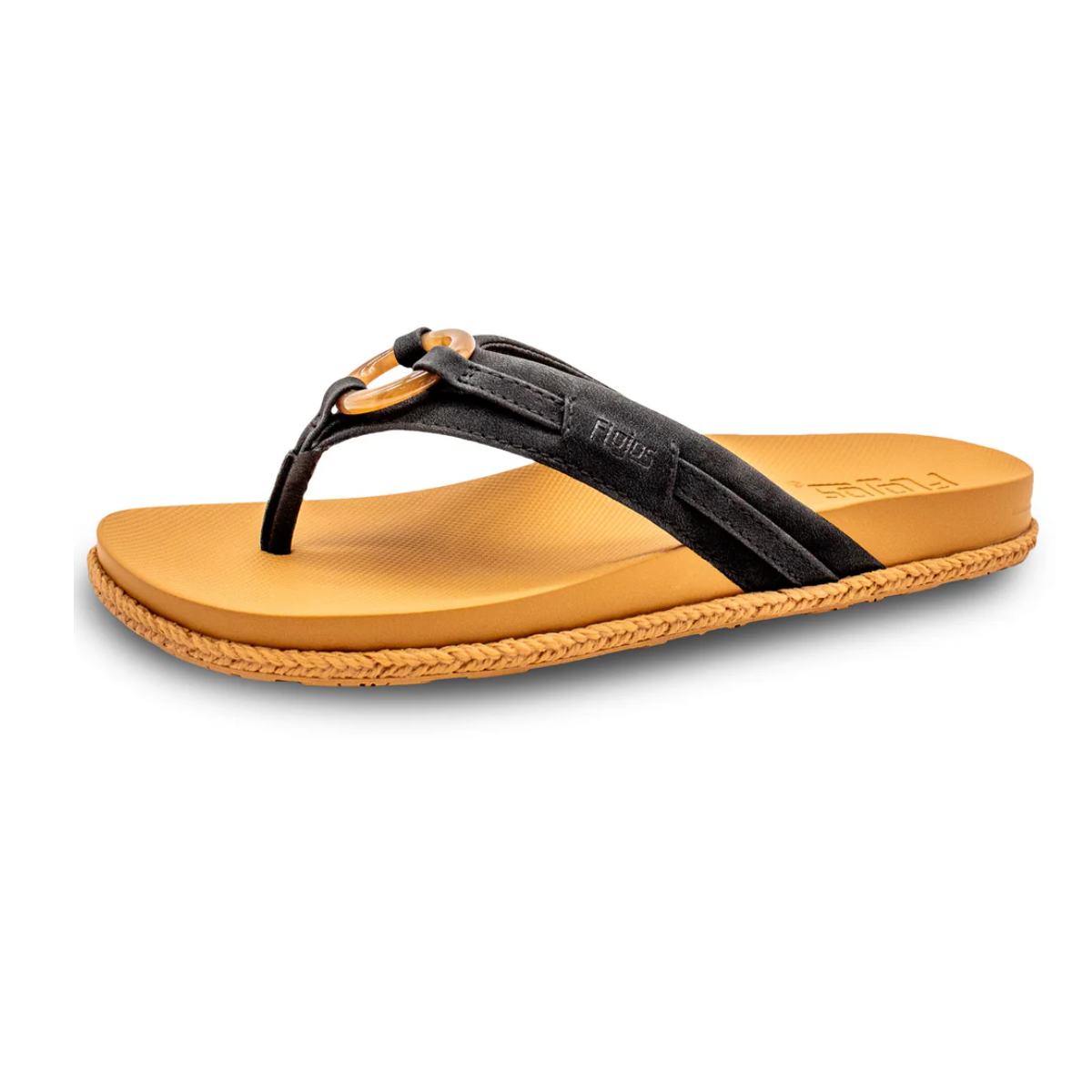 The FLOJOS Viernes Flip Flop is a black and tan women’s sandal with a textured sole, faux leather strap with loop detail, and a memory foam footbed, shown against a white background. Main image