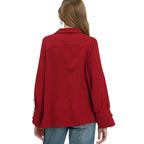 A person is shown from the back wearing blue jeans and an Umgee Striped V-Neck Collared Blouse in deep red/crimson.