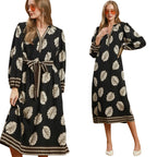 Women's Umgee black and brown mixed leaf print midi dress with contrast trim, balloon sleeves, tie waist and side pockets