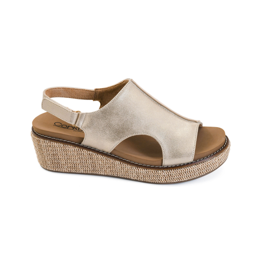 The Volta II Low Wedge in Washed Gold by CORKY'S FOOTWEAR INC features a metallic finish, open toe, elastic slingback strap, woven-texture sole, cushioned footbed, and comfortable platform heel.
