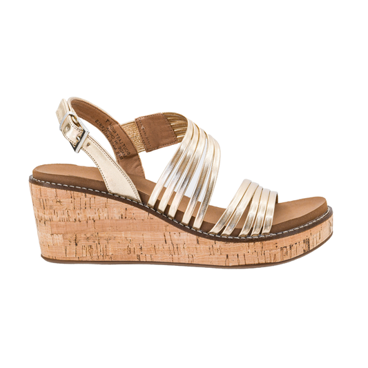 The About Last Night Gold Strappy Wedge by CORKY'S FOOTWEAR INC features a gold shimmer finish, cork platform sole, cushioned footbed, and adjustable ankle strap, shown in a side view on a white background.