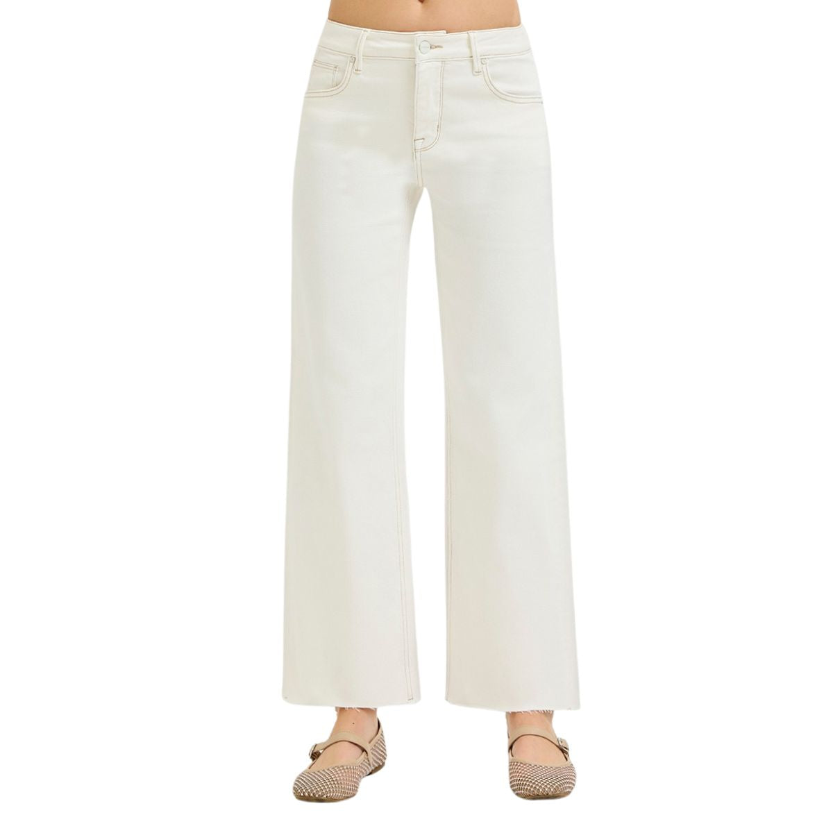 A person wearing Fashiongo Tummy Control Mid Rise Ankle Straight Raw Hew Pants in white with beige flats. The photo is cropped from midriff to feet.