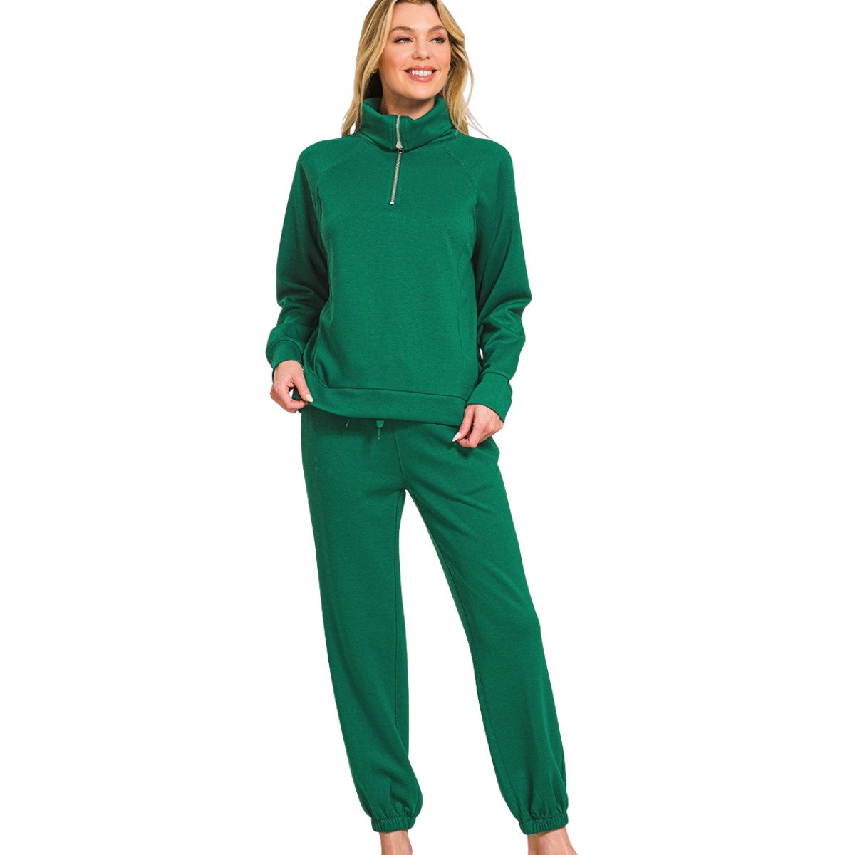 A woman smiles in the FASHION GO Scuba Half Zip Sweatshirts & Joggers Set, a green tracksuit with long sleeves and zip-up collar made from soft polyester rayon spandex, posed against a white background.