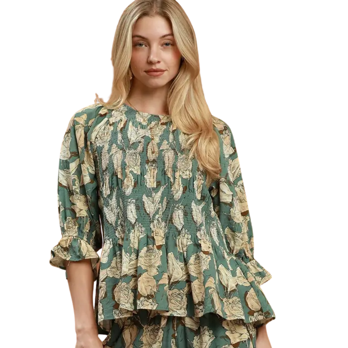 A woman wears the Umgee Mix Floral Smocked Yoke Ruffle Sleeve Blouse, styled with matching pants.