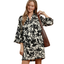 Floral print relaxed shift dress with split neckline, wide sleeves, contrast stitching, and side pockets