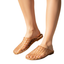 A person wearing the SUMMER RIO Natural Clear Jelly Mule—tan, slip-on sandals featuring a minimalist lattice design—on bare feet, standing against a white background.