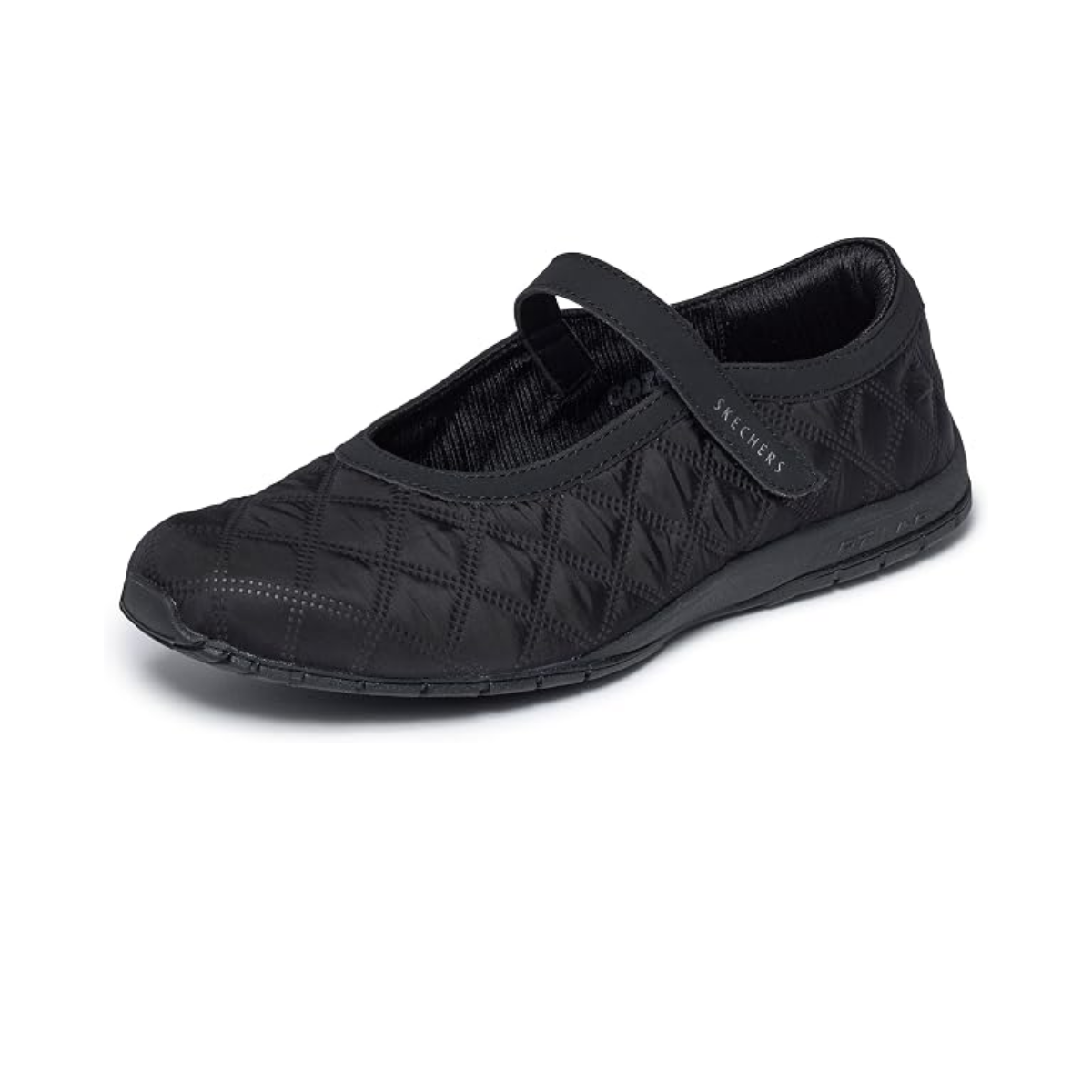 The SKECHERS Retro Lite - Cozy Fit Mellow Maryjane Sneaker is a black flat shoe with quilted stitching and a single velcro strap across the top, featuring Skechers Memory Foam for lightweight comfort, shown on a white background.