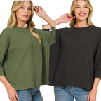 Two women wearing FASHION GO's Double Knit 3/4 Sleeve Top—one in olive green and one in dark gray—both featuring a crew neck and elbow-length sleeves styled like a 3/4 sleeve top, paired with blue jeans, standing against a white background.