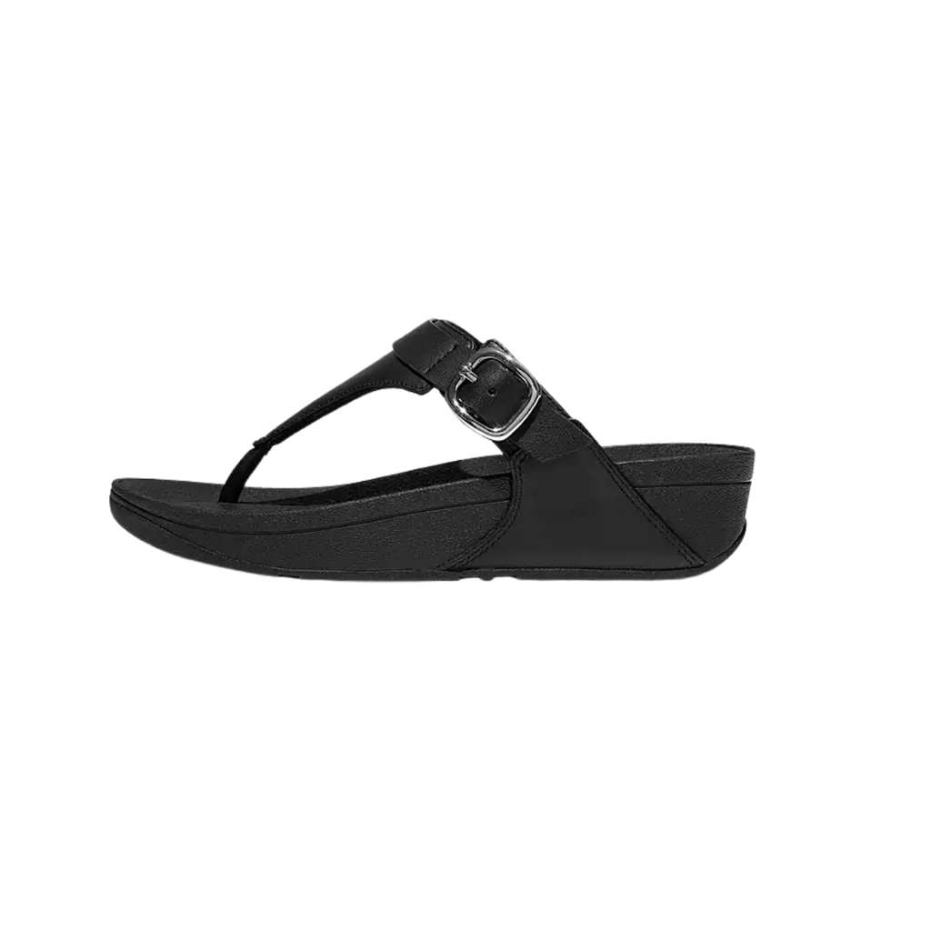 Shown in profile on a white background, the Fit Flops LULU Adjustable Leather Toe-Posts feature black leather, a wedge sole, side buckle, and signature Microwobbleboard midsole—reimagined for all-day comfort.