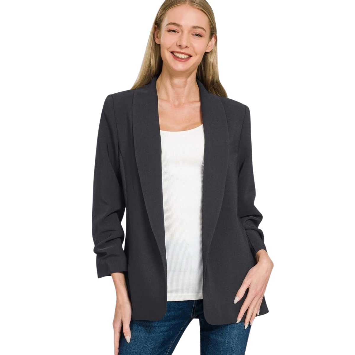 A woman smiles in the Zenana Woven 3/4 Ruched Sleeve Open Front Classic Blazer, styled over a white top and blue jeans, against a plain white background.
