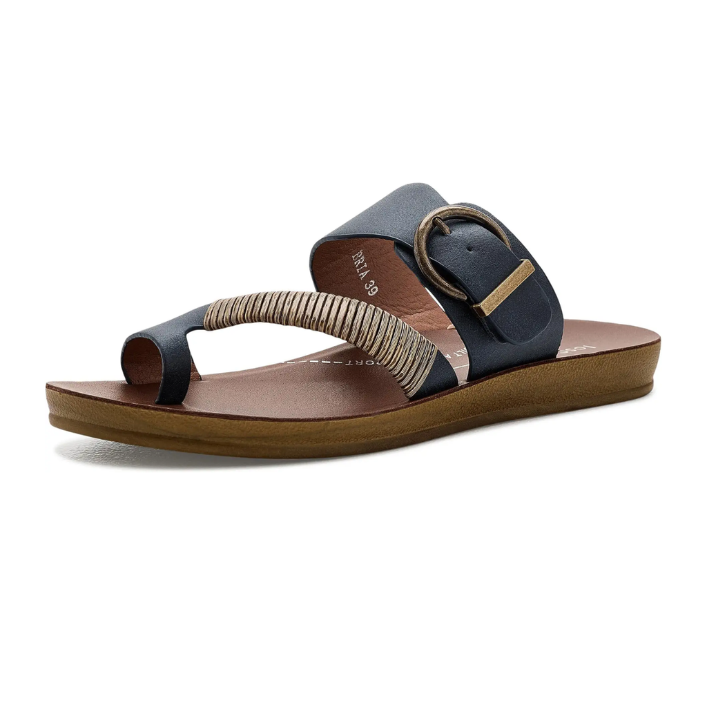 A single Los Cabos Bria Sandal in black and brown, featuring a toe loop, woven bamboo wrap strap, large buckle detail, and flat sole, is shown on a white background.