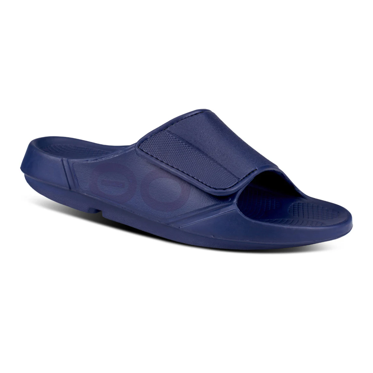 Sport Flex In Navy by Oofos from OOFOS LLC: navy blue open-toe slide sandal with a wide adjustable upper strap, patented comfort footbed, and slightly raised heel, shown on a white background. Main image