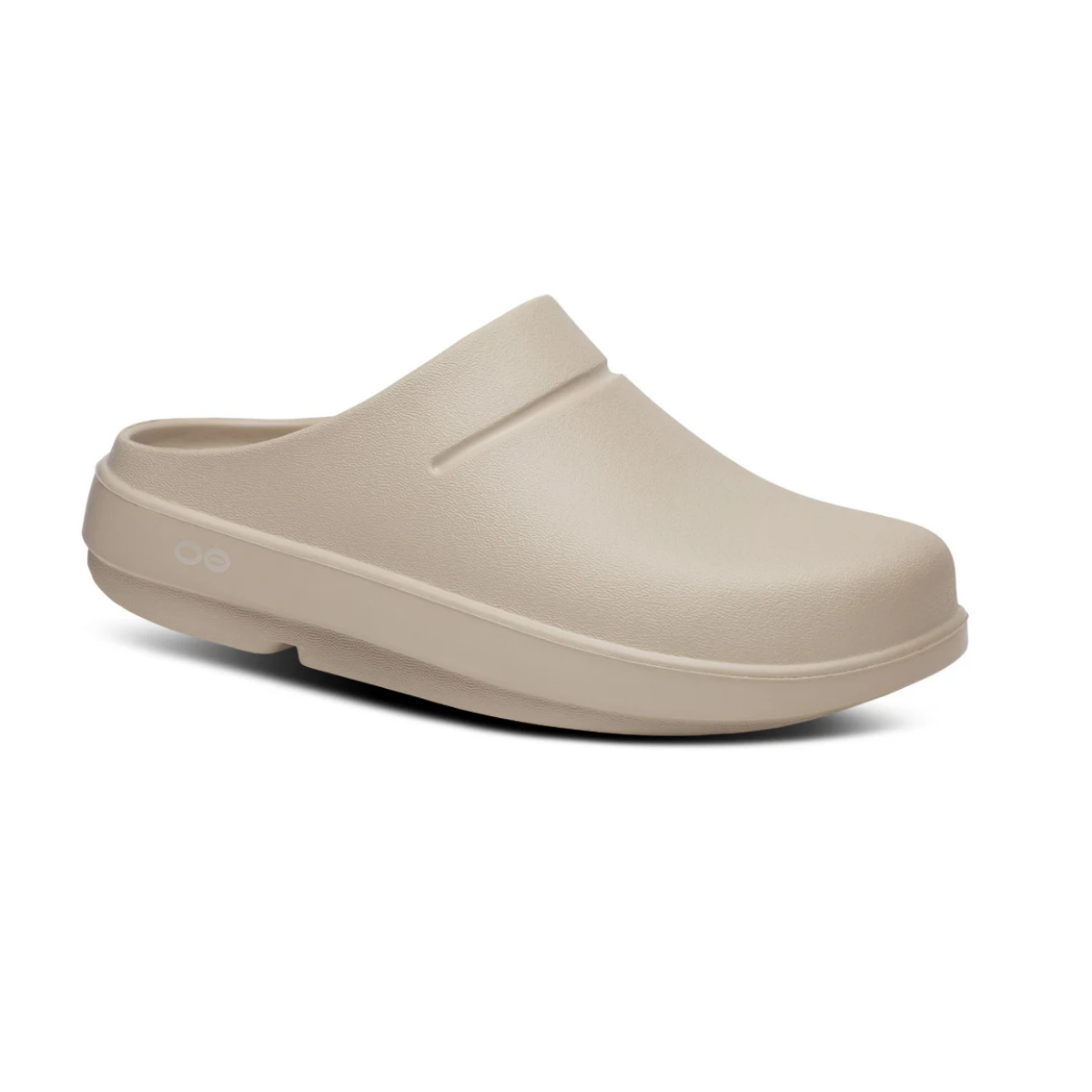 The Oocloog Clog in Nomad by OOFOS LLC is a beige slip-on with a closed toe and backless heel, featuring a thick, contoured sole for arch support and a minimal design. Main image