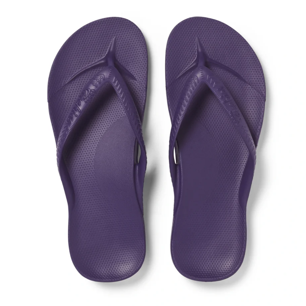 A pair of ARCHIES Archies Flip Flops in Acai Purple with arch support, viewed from above on a white background.