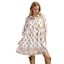 A woman wears the Gigio Printed Shirt Dress—a white, loose-fit lined rayon dress with brown and gold floral patterns, long sleeves, and a collar—paired with tan knee-high boots.
