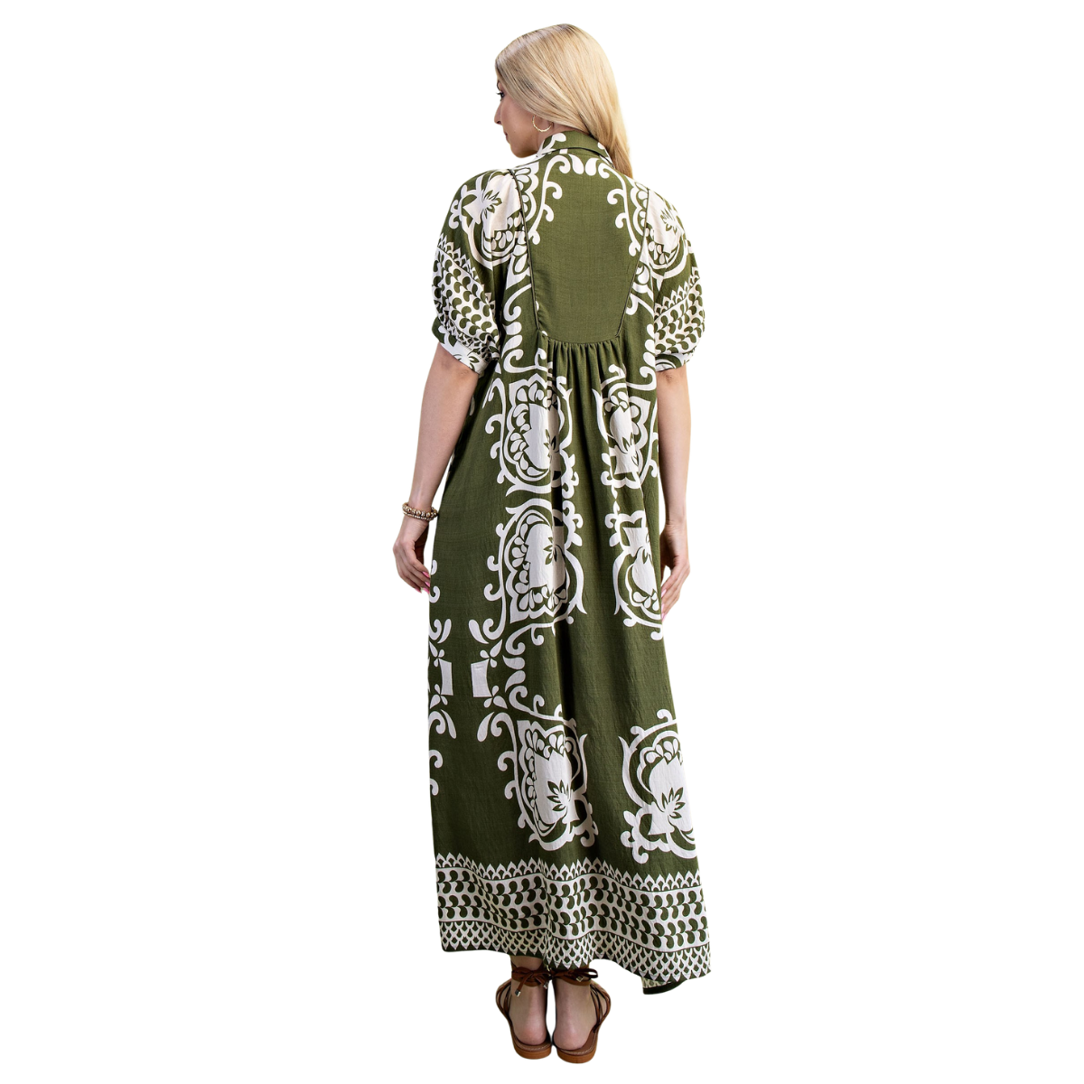 A woman with long blonde hair wears the FASHION GO Paisley Print Puff Sleeve Midi Dress in off white, paired with brown sandals, standing and facing away from the camera.