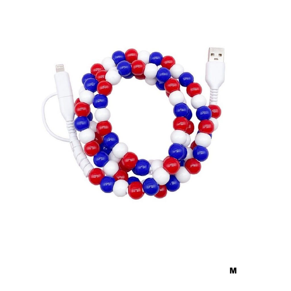 The Zenana Beaded DUAL USB FAST CHARGING CABLE in assorted colors is elegantly coiled on a white background, with a black "M" at the bottom right. This cable offers universal compatibility and fast charging.