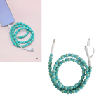 The Zenana Beaded DUAL USB FAST CHARGING CABLE, shown coiled and plugged into a phone, offers universal compatibility for all your devices in assorted colors with a stylish beaded design.