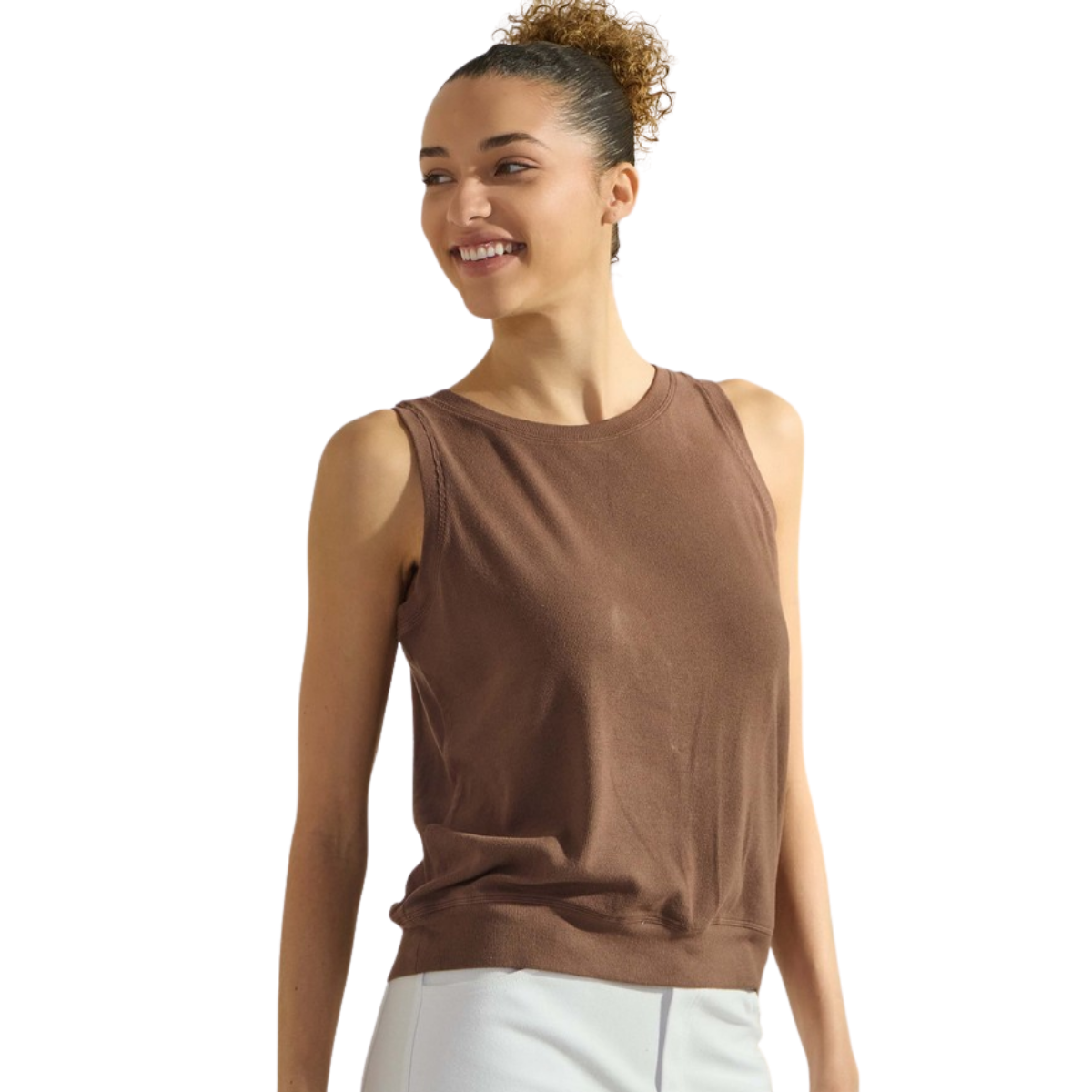A woman wears the FASHION GO Women's Ribbed Viscose Crew Neck Tank in brown with light pants, standing and smiling against a white background.
