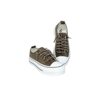 The VERY G Harmon Sparkle Sneaker is a pair of chocolate brown suede lace-up sneakers featuring rhinestone-accented laces and white rubber soles, displayed on a white background.