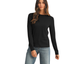 A woman faces forward against a white background, one hand slightly bent, wearing the FASHION GO Long Sleeve Basic Ribbed Knit Top in a slim fit with blue jeans—a perfect wardrobe staple for effortless style.