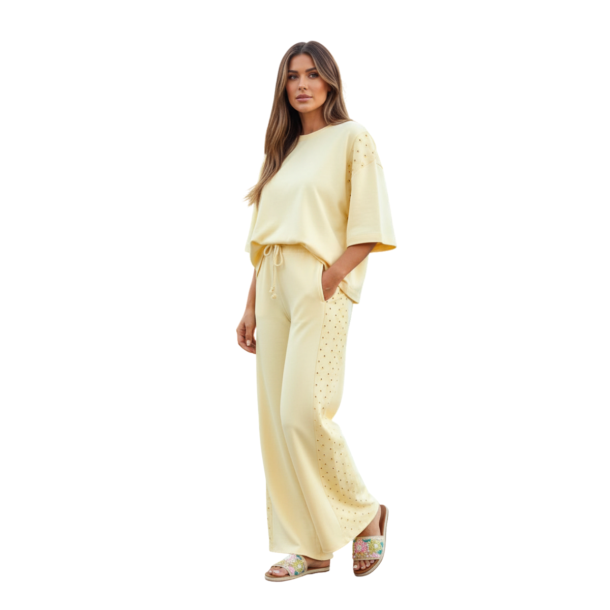 A woman models the 1 the Woman Oversize Tee Drawstring Loose Pants 2pcs Outfit, styled with floral sandals, standing against a white background.