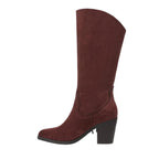 The Criss 2 Fringe Boot by Caleres is a brown suede, knee-high cowgirl boot featuring a pointed toe and a thick, mid-height chunky block heel, displayed in side profile against a white background.