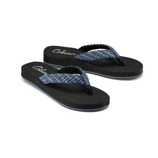 Indigo flip-flops with blue, braided straps, featuring the "Cobian" brand name printed on the footbeds.