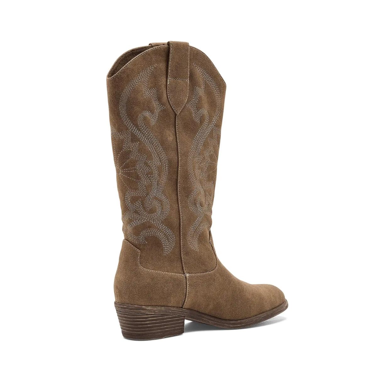 The Stutter Western Boot by Flipflops & Whatnots is shown in a left side profile view, crafted in brown suede with cowboy-inspired decorative stitching, a low stacked heel, and pull tabs at the top.