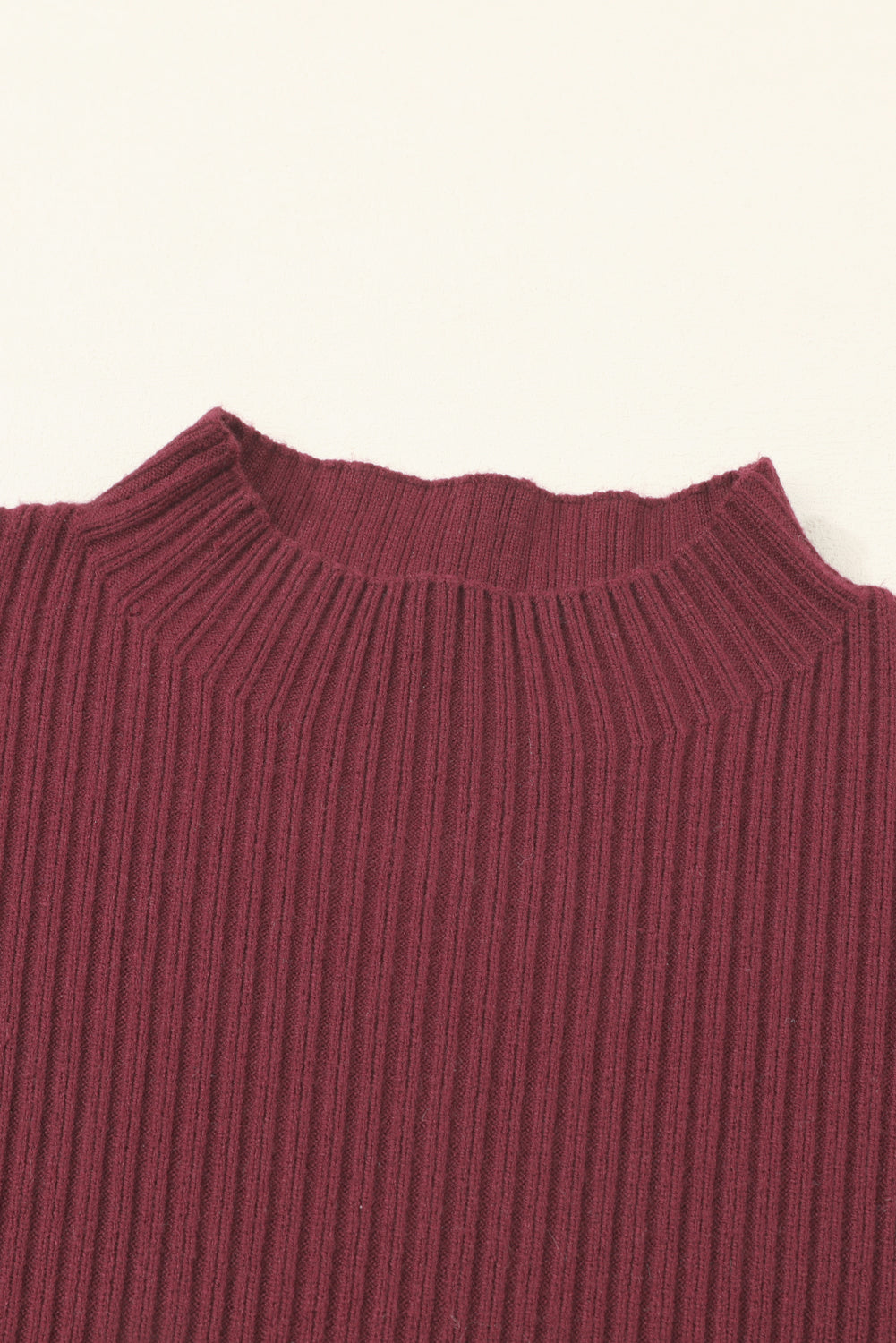 Close-up of Shewin's Patch Pocket Ribbed Knit Short Sleeve Sweater in maroon, featuring a mock neck detail on a white background, highlighting its versatility for transitional weather.