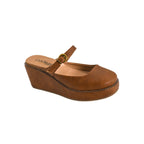 Women will love the Me Time Wedge by CORKY’S FOOTWEAR INC: This brown wedge-heeled Mary Jane features a comfortable platform sole, strap and buckle detail, and a closed rounded toe—making it one of the most comfortable wedge sandals for all-day wear, shown against a white background.