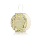 Round, holiday ornament-style Spongelle Holiday Bath Soap Sponges buffer in gold packaging with a ribbon loop for hanging.