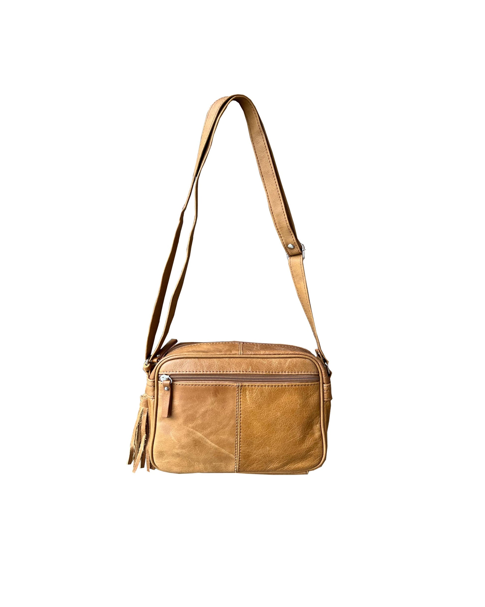The Roma Leathers, Inc. Cowhide Leather Crossbody features tan cowhide leather, an adjustable shoulder strap, front zipper pocket, and tassel accent, shown on a white background.