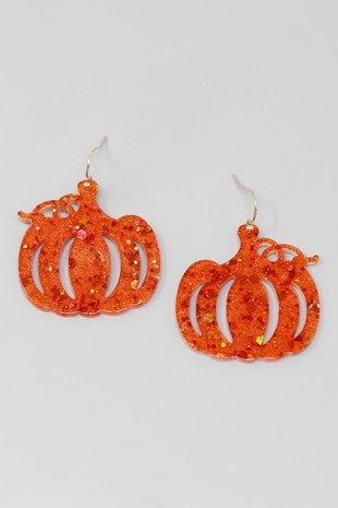 The Pumpkin Dangle Earrings from us jewelry house, crafted from orange glittery material and shaped like pumpkins, are displayed against a plain white background.