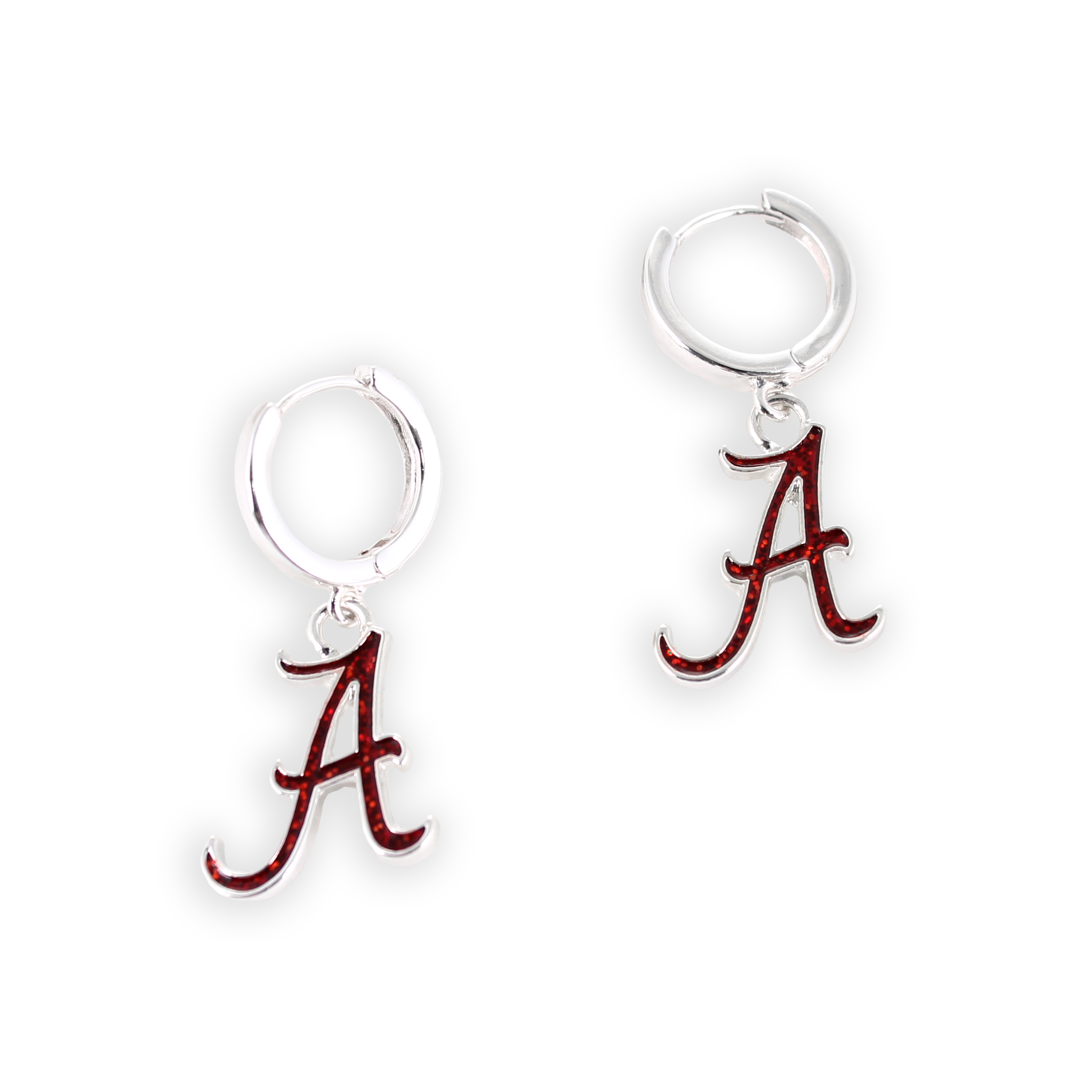 A pair of Alabama Glitter Enamel Logo Huggie Hoop Earrings by Seasons Jewelry features silver huggie hoops, each adorned with a red Alabama “A” logo charm in crimson glitter enamel, dangle elegantly from the hoops and are displayed against a plain white background.
