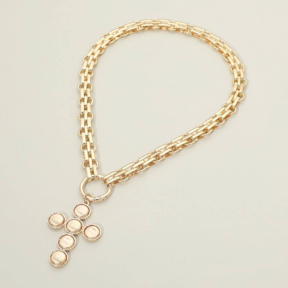 Sensibling Corp.’s Pearl Cross Charm Pendant Chunky Chain Statement Necklace, featuring a gold chunky chain and a textured cross pendant adorned with six round, light-colored pearl-like stones, is showcased against a plain, neutral background.