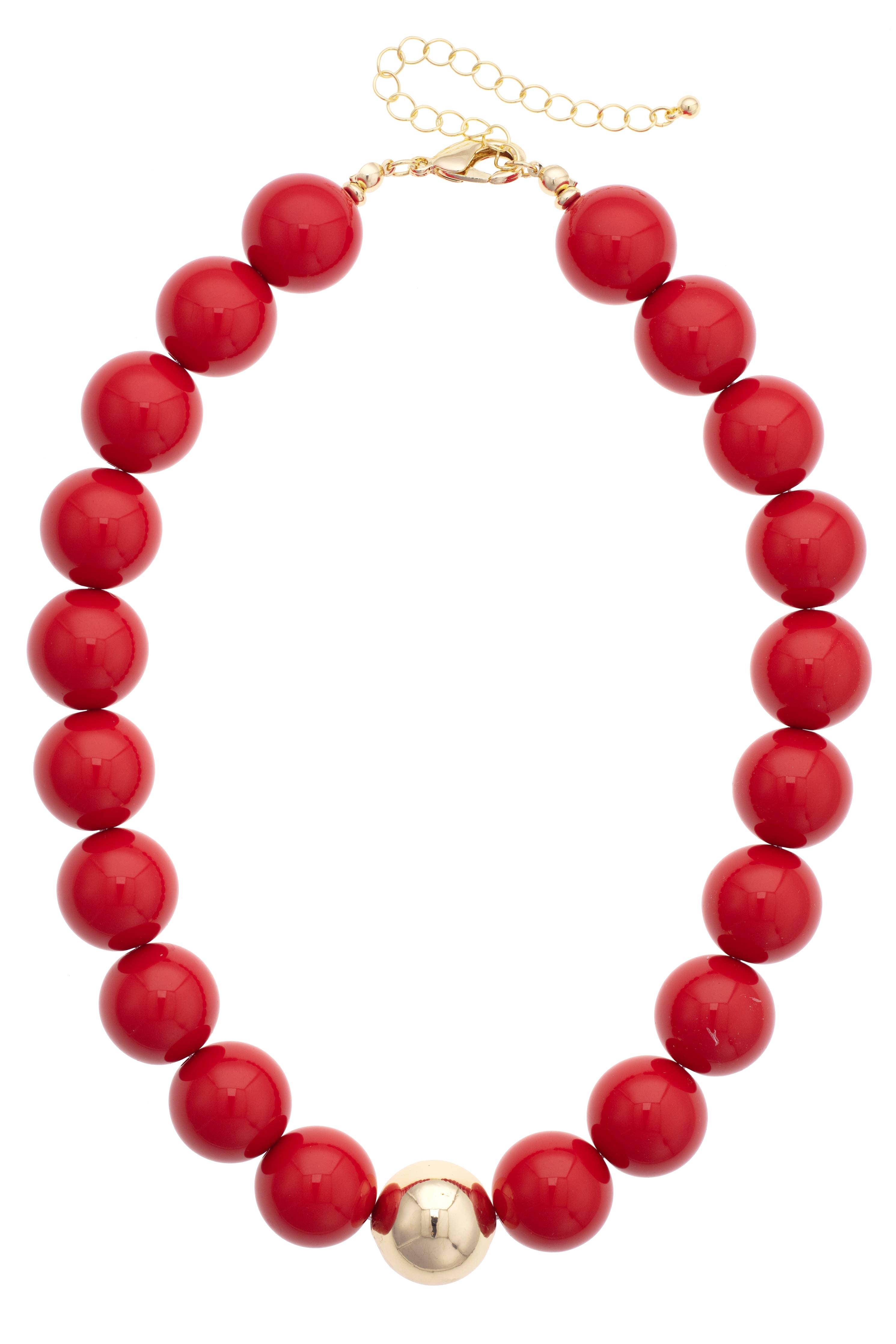 The Marjorie Game Day Beaded Necklace by Canvas Style features large, glossy red beads highlighted by a central gold bead, finished with a gold clasp and adjustable chain—an eye-catching statement piece perfect for adding bold flair to any outfit.