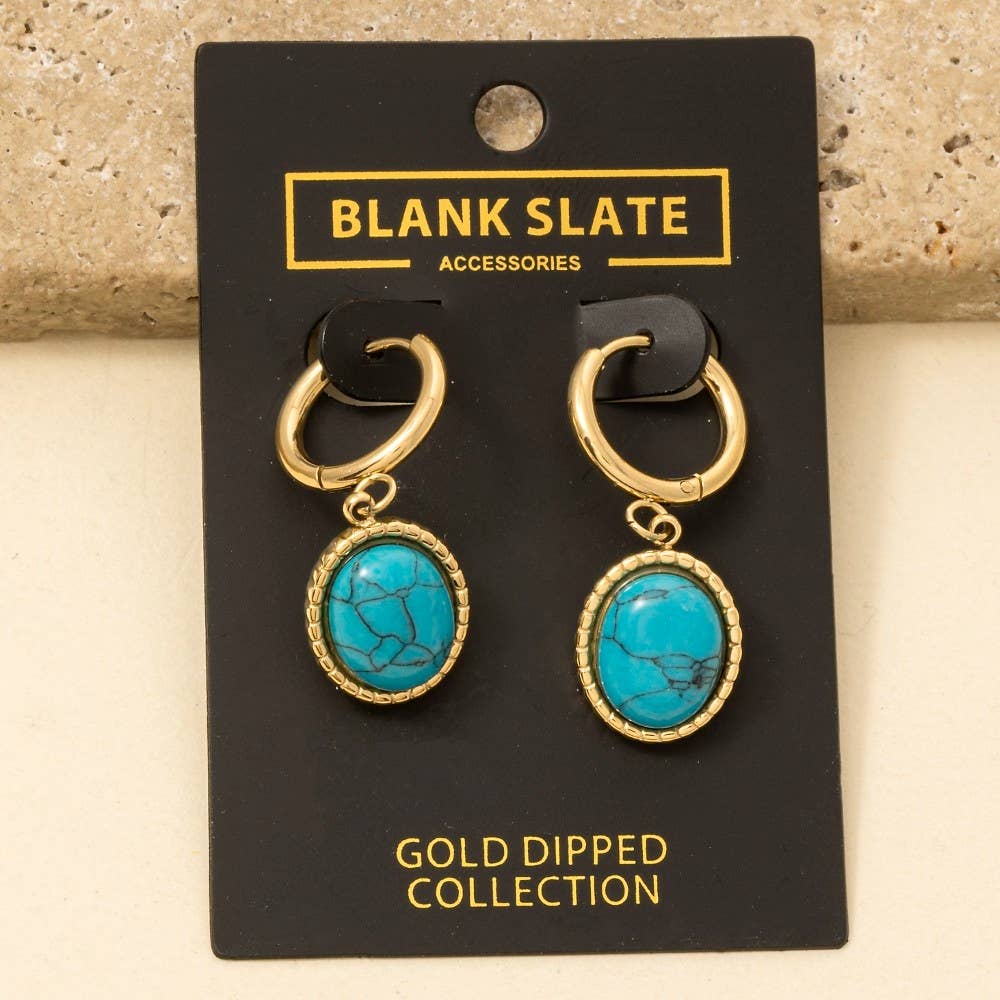 A pair of Oval Turquoise Stone Drop Earrings by Anarchy Street, featuring gold-tone hoops with oval turquoise pendants, displayed on a branded card from the Gold Dipped Collection.