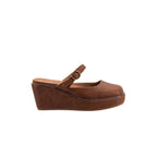 The Me Time Wedge by CORKY’S FOOTWEAR INC is a women’s Mary Jane shoe featuring a round toe, ankle strap with buckle, white stitching, and closed back—shown in side profile on a white background—making it an ideal choice for those seeking comfortable wedge sandals with timeless style.