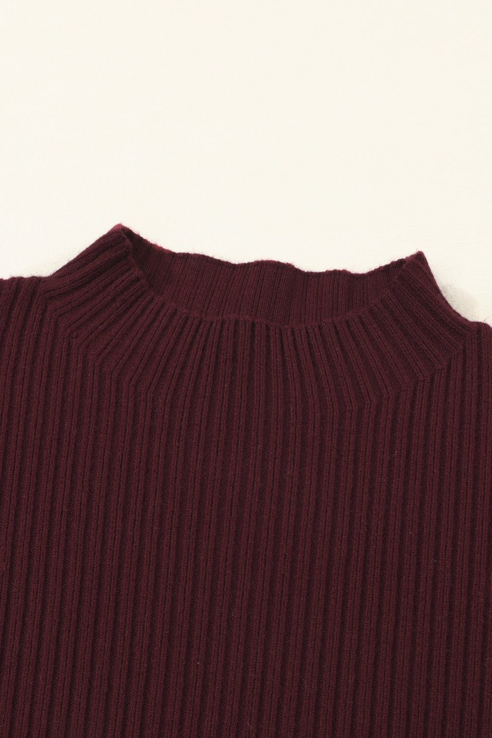 Close-up of Shewin's Patch Pocket Ribbed Knit Short Sleeve Sweater in dark red with a high neckline, perfect for casual wear during transitional weather, against a neutral background.