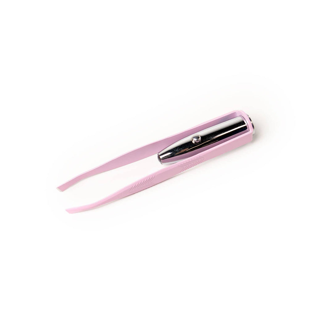 Lemon Lavender Light Up Tweezer in light pink, featuring a precision grip, a built-in LED spotlight, and a central chrome push-button switch.