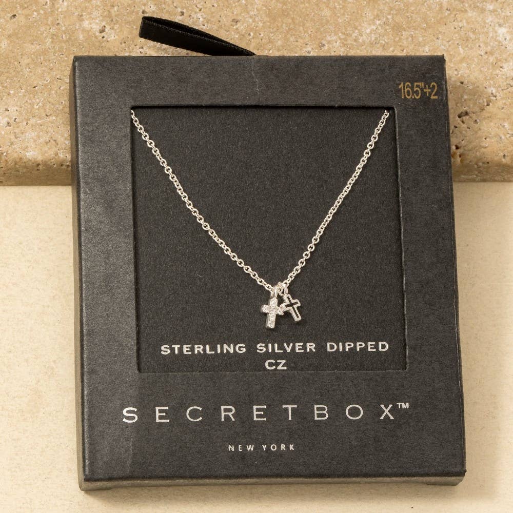 The Secret Box Gold Dipped Cz Cross Pendant Necklace by Anarchy Street features a sparkling cubic zirconia cross and comes in sleek black Secret Box New York packaging.