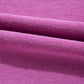 Close-up of folded magenta fabric with a textured surface, similar to the Shewin Notched Neck Exposed Seam Drop Shoulder Sweatshirt crafted from high-quality material.