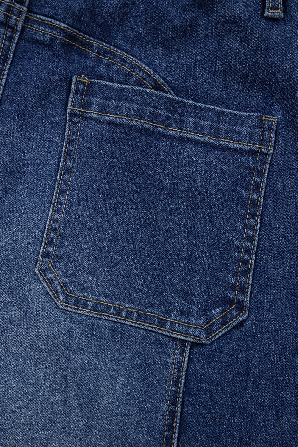 Close-up of 1 the Woman Drawstring Seam Detail Raw Hem Wide Leg Denim Pants in blue, featuring a back pocket with visible stitching that showcases the detailed craftsmanship of these deconstructed jeans.