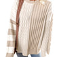 A person is wearing a Shewin Khaki Cable Knit Colorblock Crew Neck Drop Shoulder Sweater with blue jeans and a shoulder bag.