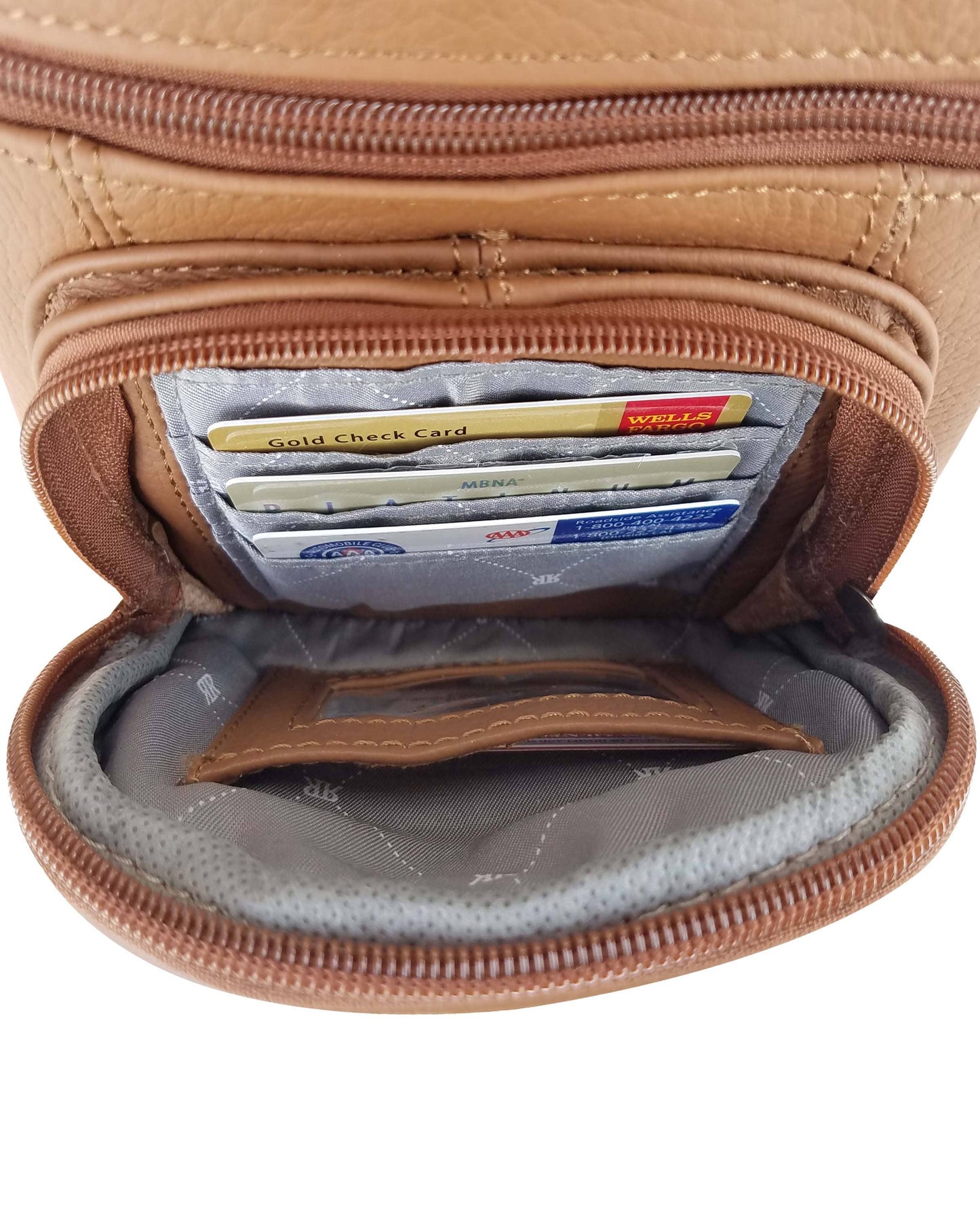 A close-up of the Roma Leathers, Inc. cowhide leather crossbody with phone pocket, featuring organized card slots holding several credit and bank cards.