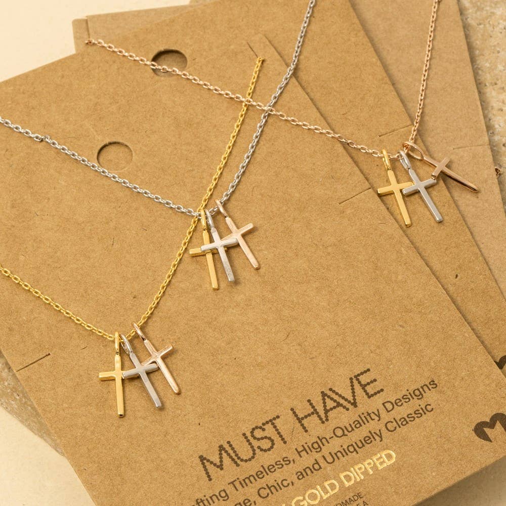 The Anarchy Street Triple Cross Pendant Necklace features three mixed metal crosses, 18K gold dipped, presented on "MUST HAVE" packaging.